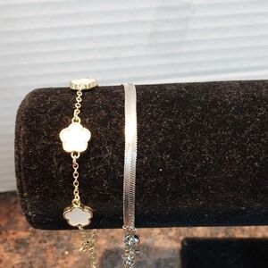 2 Silvertone Bracelets The Cloverleaf Looks Just Like the expensive one.